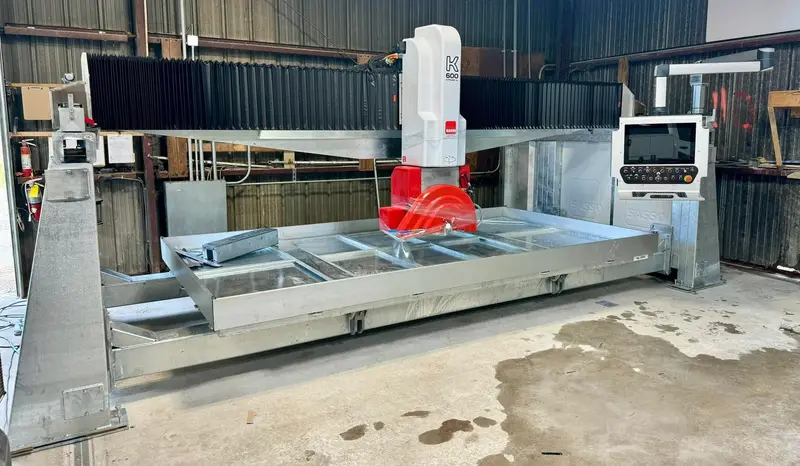 The Rocky Tops Sasso CNC bridge saw in the Cayce shop, used to template and cut countertops